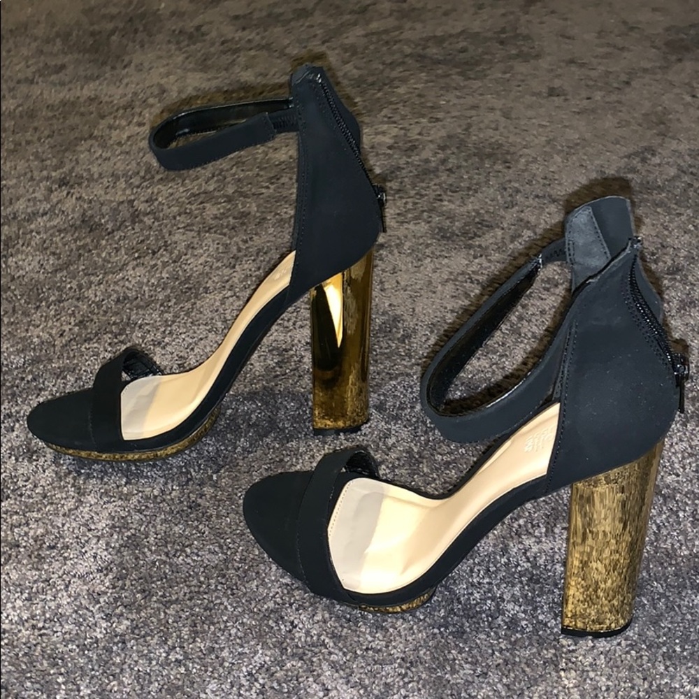 thick gold heels with black straps